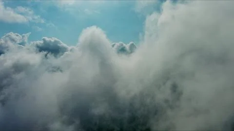 Clouds and blue sky, flying in clouds Stock Photos