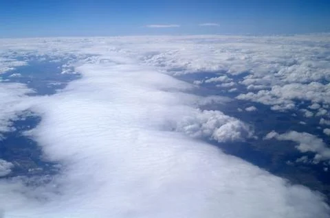Clouds and blue sky seen from plane Stock Photos