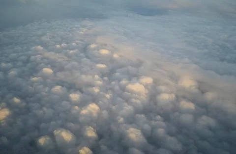 Clouds and blue sky seen from plane Stock Photos