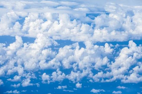 Clouds and blue sky, view from airplane Stock Photos