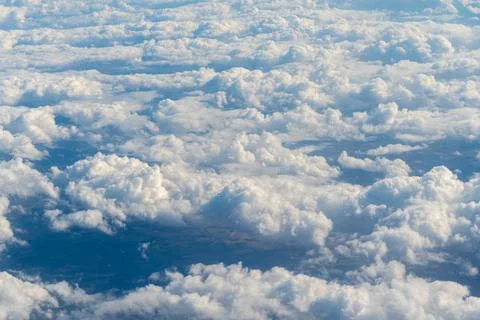 Clouds and blue sky, view from airplane Stock Photos