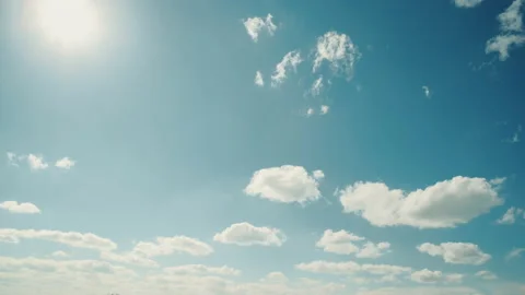 Clouds and blue sunny sky, The flight of the sun to the horizon of the earth Stock Footage 199474765