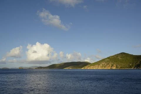 Clouds and cliffs on Peter Island, Peter Island, British Virgin Islands Stock Photos