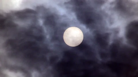 Clouds and dark smoke drifting past sun Stock Footage 37048169