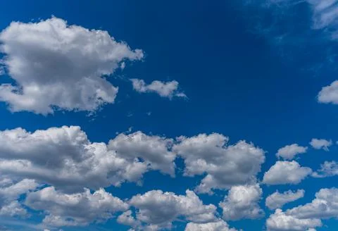 Clouds and deep blue sky background with text space Stock Photos