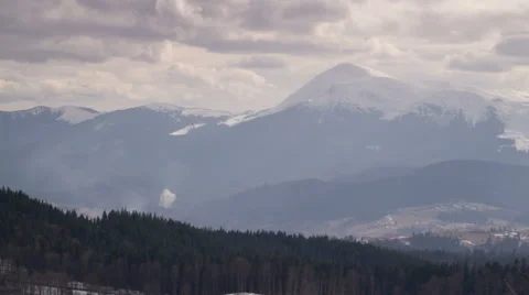 Clouds and Fast Shadows Moving Across the Valley and the Slope of the Mountain Stock Footage 48459382