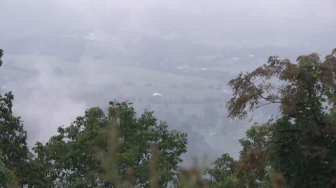 Clouds and fog lifting over the valley Vidéo 36069907