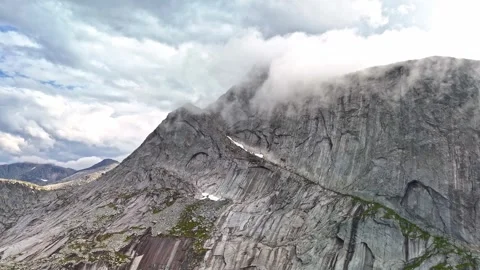 Clouds and fog rolling over mountain tops in Efjord in Northern Norway Stock Footage 283627705