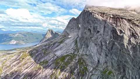 Clouds and fog rolling over mountain tops in Efjord in Northern Norway Stock Footage 283628184