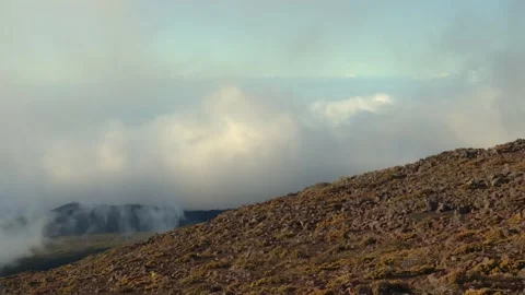 Clouds And Fog Rolling Over Rocky Terrain of Haleakala National Park in Maui Stock Footage 337143904
