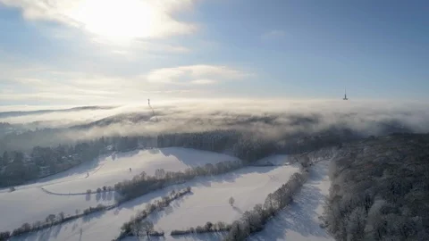 Clouds and fog spreading over winter landscape in German Eifel Stock Footage 102514256