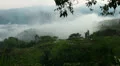 Clouds and fog timelapse with cemetery after rain in a small Jungle HD Footage