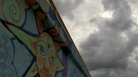 Clouds and graffiti wall time lapse Video stock 55344750