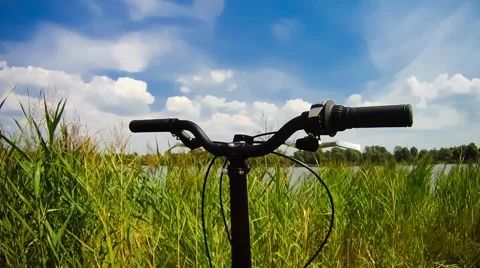 Clouds and grass motion timelapse from a bicycle Stock Footage 53088794
