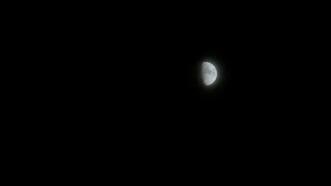 Clouds and haze distort big bright first quarter half moon northern hemisphere Stock-Footage 81607889