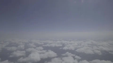 Clouds and horizon from plane 59 94fps 1920x1080 Stock Footage