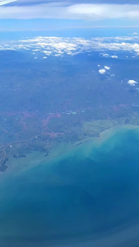 Clouds and land view from an airplane Video stock 276939214