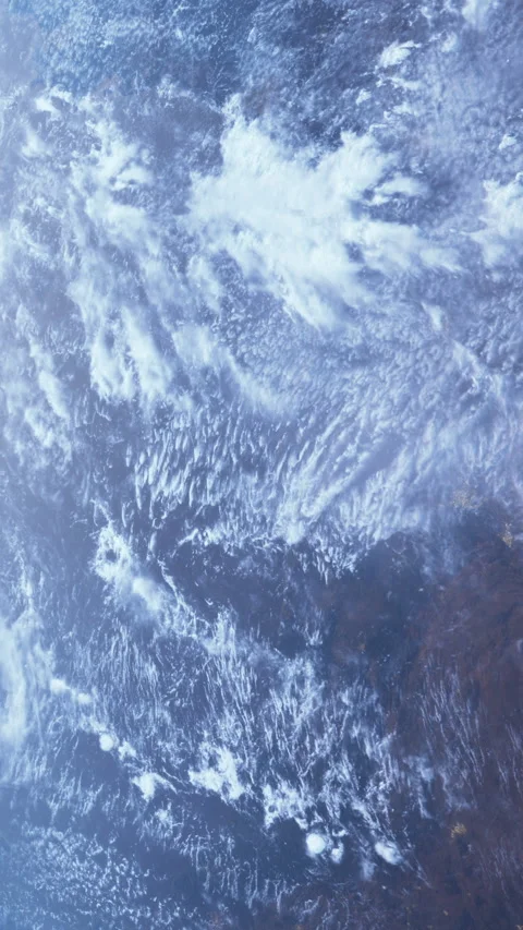 Clouds and land viewed from space over the ocean during daylight hours Stock Footage 341048223