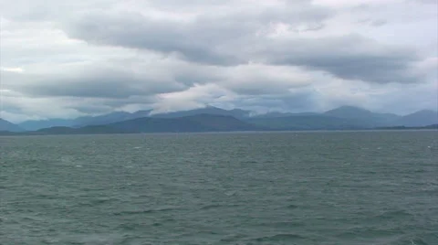 Clouds and loch landscape from moving boat Stock Footage 39815994