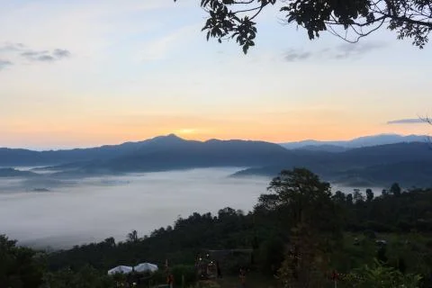 Clouds and mist covered at the top of the mountain. Stock Photos