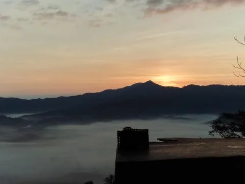 Clouds and mist covered at the top of the mountain. Stock Photos