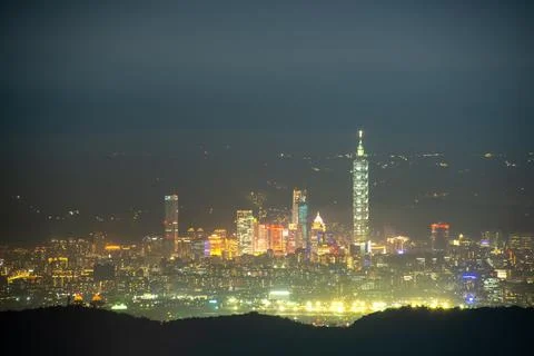 Clouds and mist drift over the city, and the colorful glaze light shines. Stock Photos