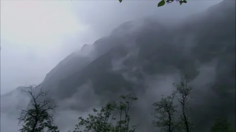 Clouds and mist drift in the valley Stock Footage 261632542