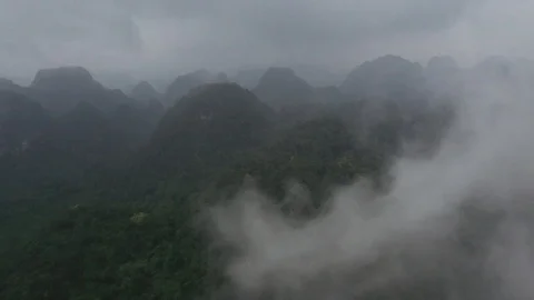 Clouds and Mountain Peaks in Vietnamese Jungle Drone Video Stock Footage 125498109