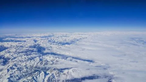 Clouds and mountain from the plane 스톡 사진