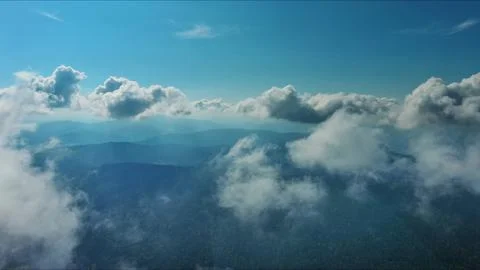 Clouds and mountains, flying in clouds Stock Photos