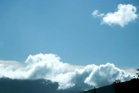 Clouds and mountains Stock Photos