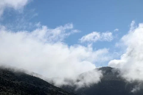 Clouds and mountains Stock Photos