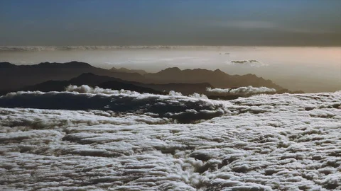 CLOUDS AND MOUNTAINS IN THE SKY 4K Stock Footage 126929822