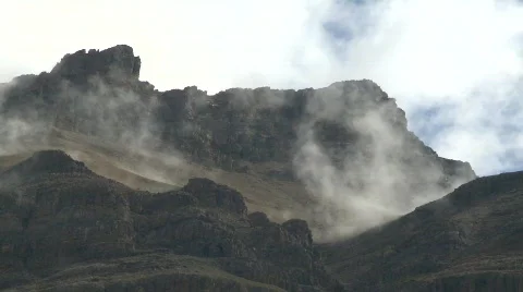 Clouds and mountains, time-lapse, #11 high angle clouds and rocky ridge Stock Footage