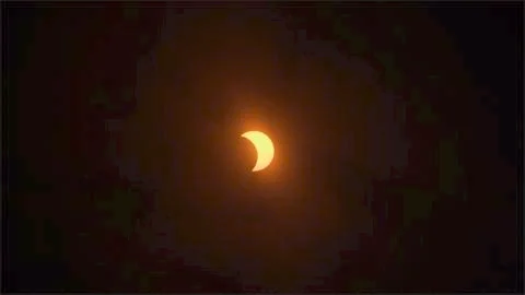 Clouds and Partial Eclipse Stock Photos