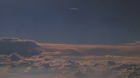 Clouds and passing plane Stock Footage 54769117