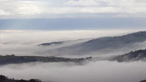 Clouds and pollution over mountains and plains timelapse Stock Footage 264054359