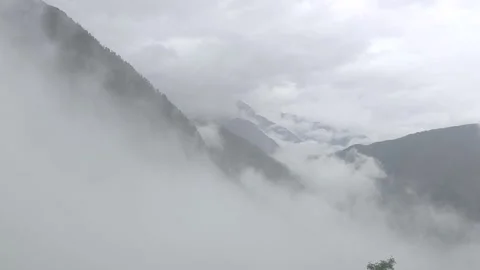 Clouds  and rain covering the whole view while hiking in the wilderness. Stock Footage 194353120