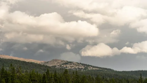 Clouds and rain evolving over mountainside Stock Footage 167434642