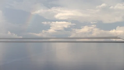 Clouds and Rainbow have solar cells in front. 動画素材 108076184