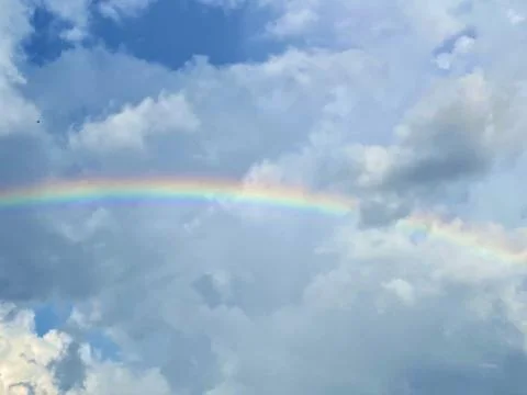 Clouds and Rainbow Foto stock