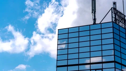 Clouds and reflections in a building timelapse 8K Stock Footage 154598066
