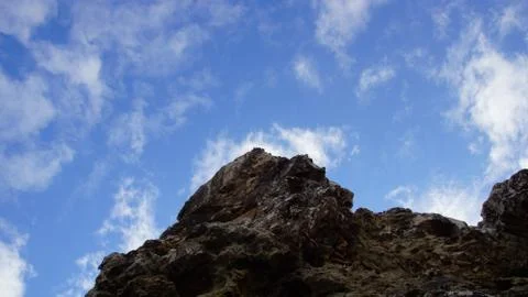 Clouds and rocks Stock Photos