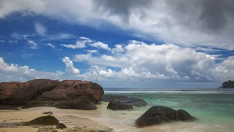 Clouds and rocky beach on a tropical island Stock Footage 155232400