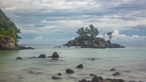 Clouds and rocky coast on a tropical island Stock Footage 155232396