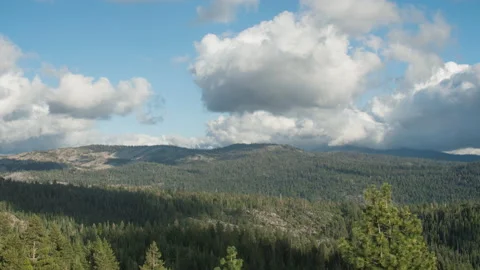 Clouds and shadows over mountain forest, timelapse from peak in mountain range Stock Footage 221387142