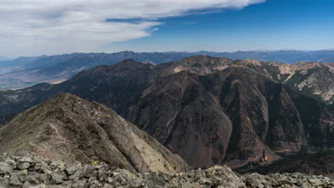 Clouds and shadows from on top of mountain peak Absaroka Mountains Stock Footage 167489265
