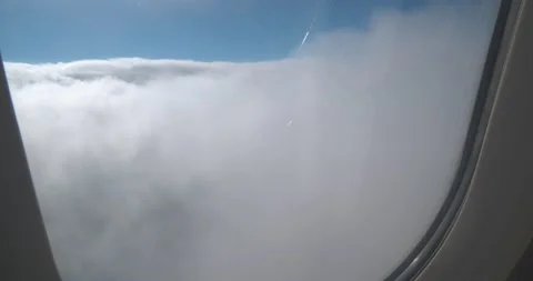 Clouds and sky from inside airplane 스톡 동영상 155820388