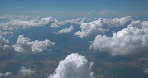Clouds and sky from inside airplane Stock Footage 155820393