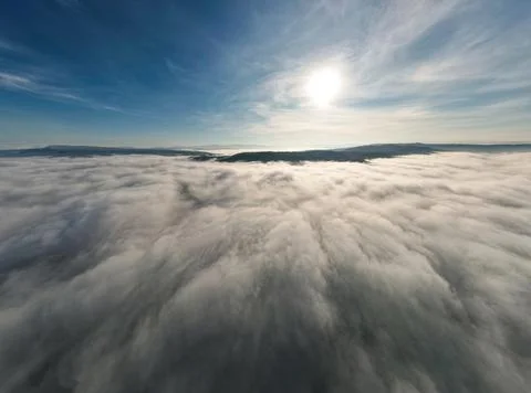 Clouds and sky over mountain from airplane window, Aerial view for nature Stock Photos